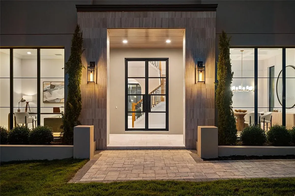 Front entrance of a Winter Park luxury home lit at night